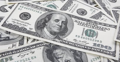 Dollar drops in choppy trading, investors rebalance for month-end